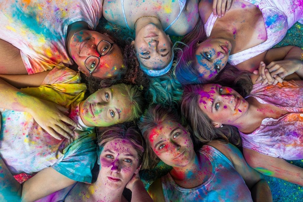 Reagan Harrison with fellow members of the MAC Senior Model Team during a group photoshoot.